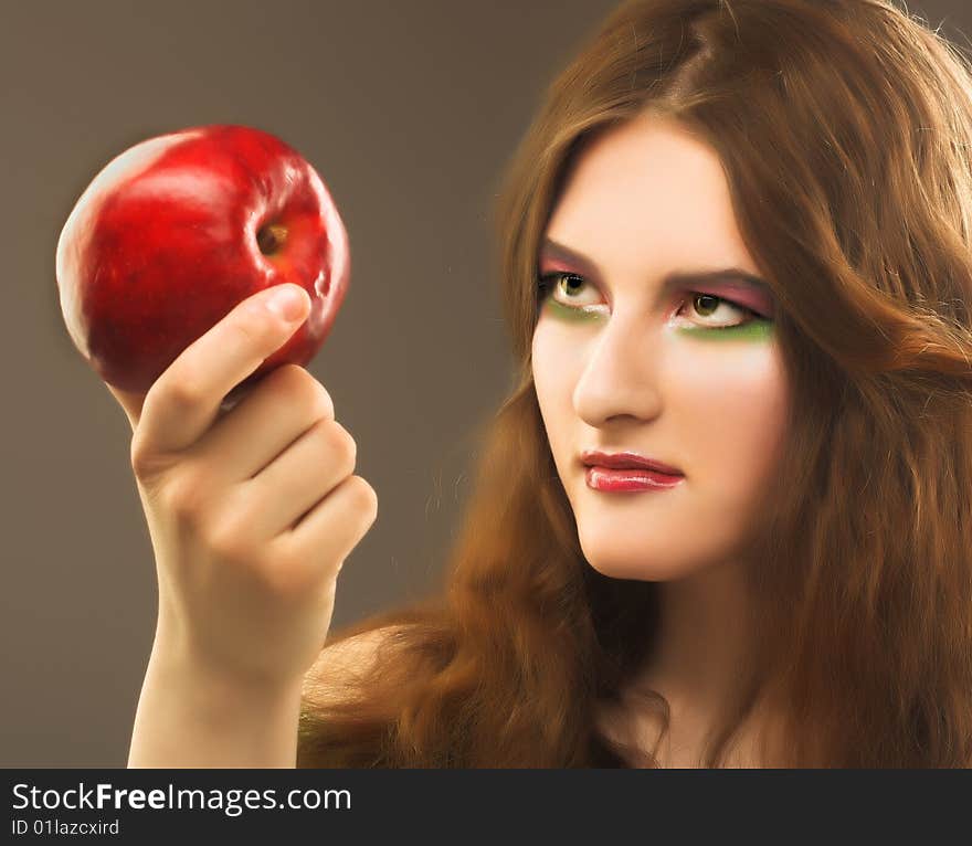 Portrait of young girl witn fresh red apple in her hand. Portrait of young girl witn fresh red apple in her hand