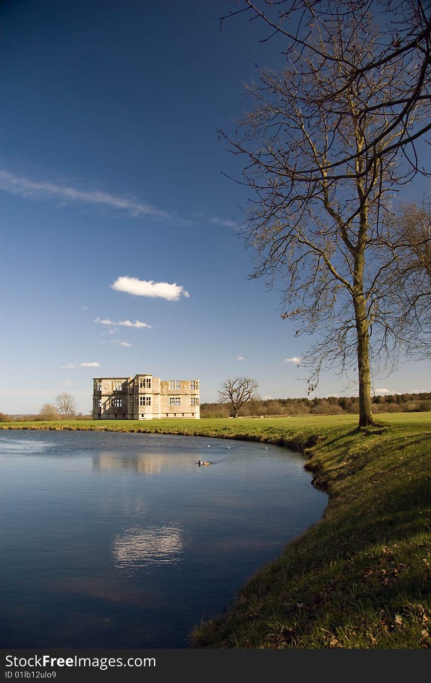 Lyvedon New Bield reflected in the water garden