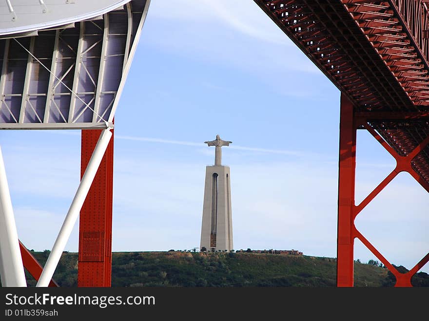 Image of the Christ Rei statue, symbol of Lisbon, from the famous 25 April Bridge. Image of the Christ Rei statue, symbol of Lisbon, from the famous 25 April Bridge.