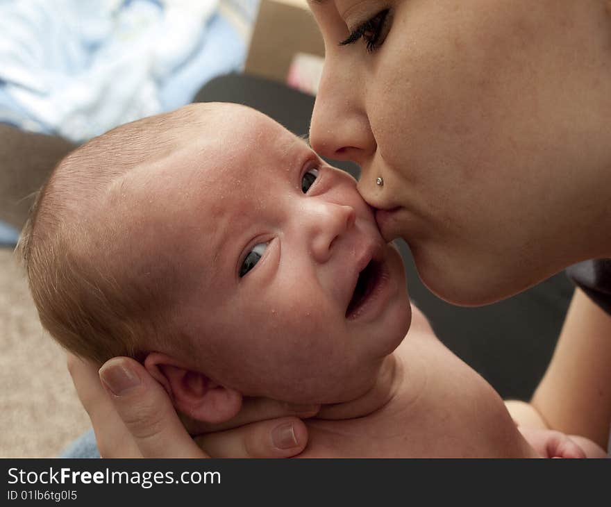 Mom Kissing Baby