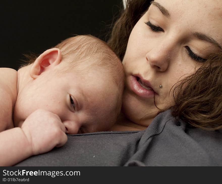 Newborn baby boy resting on mom's chest. Newborn baby boy resting on mom's chest