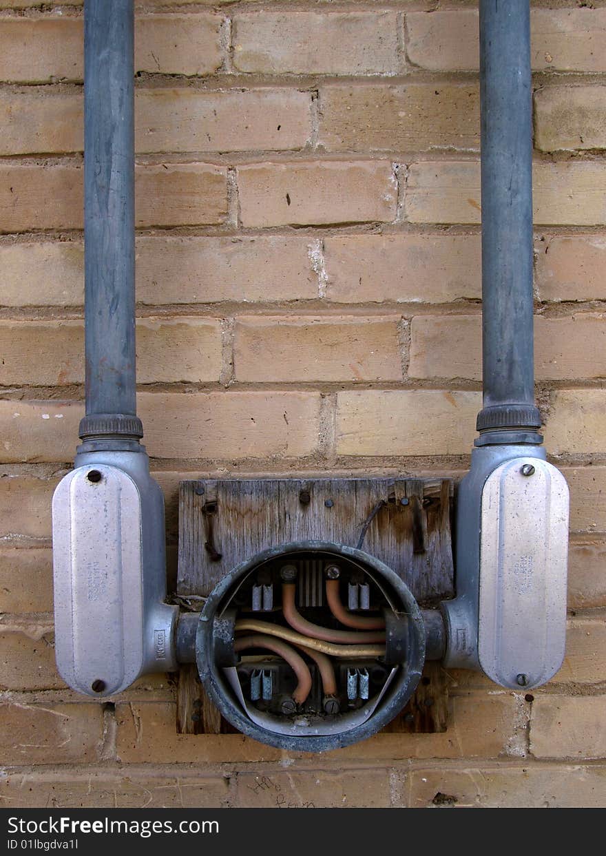 Old meter mounting terminal on the side of a building. Old meter mounting terminal on the side of a building