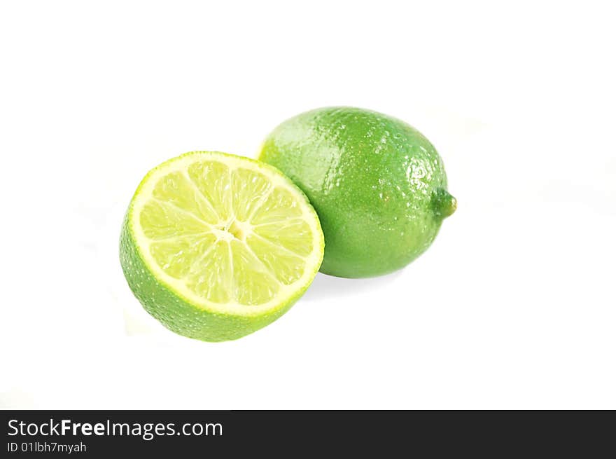 Juicy limes on white.