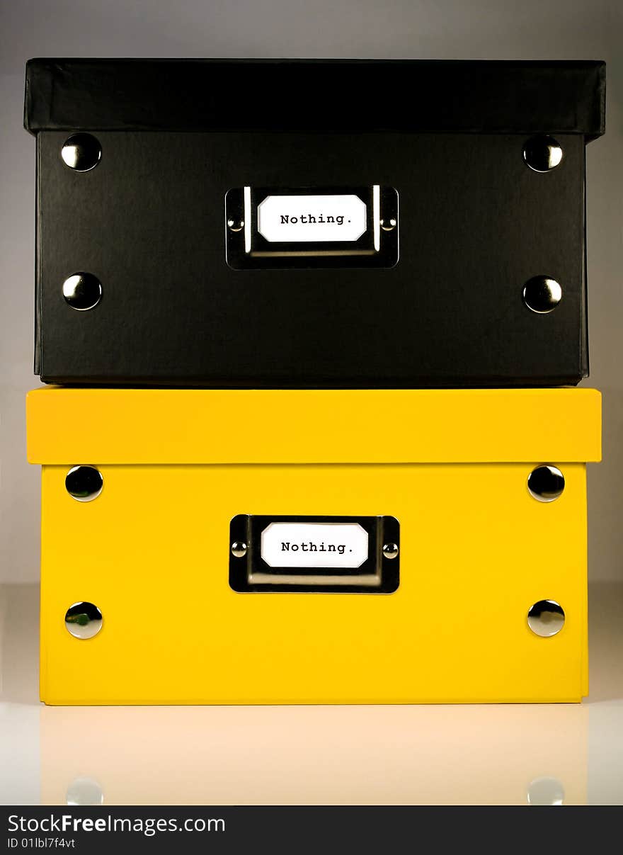 Black and Yellow office boxes sitting on each other with Nothing. label on front panel. Black and Yellow office boxes sitting on each other with Nothing. label on front panel.