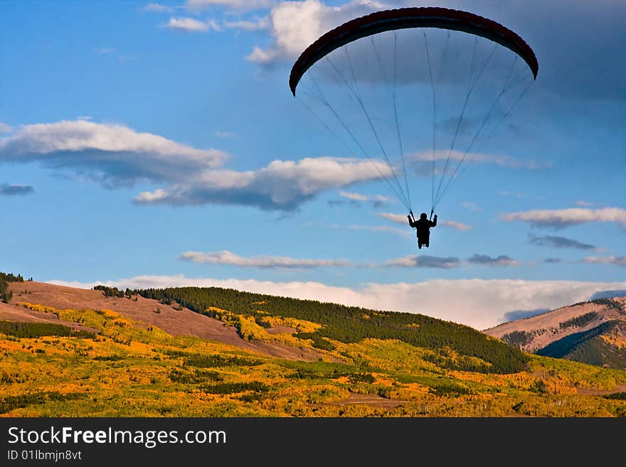 Paraglider views the fall colors from above. Paraglider views the fall colors from above.