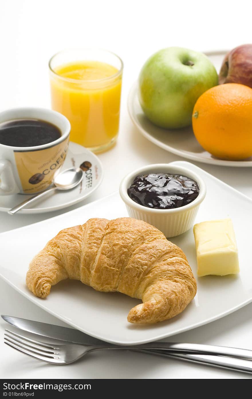 Continental Breakfast Of Coffee And Croissants