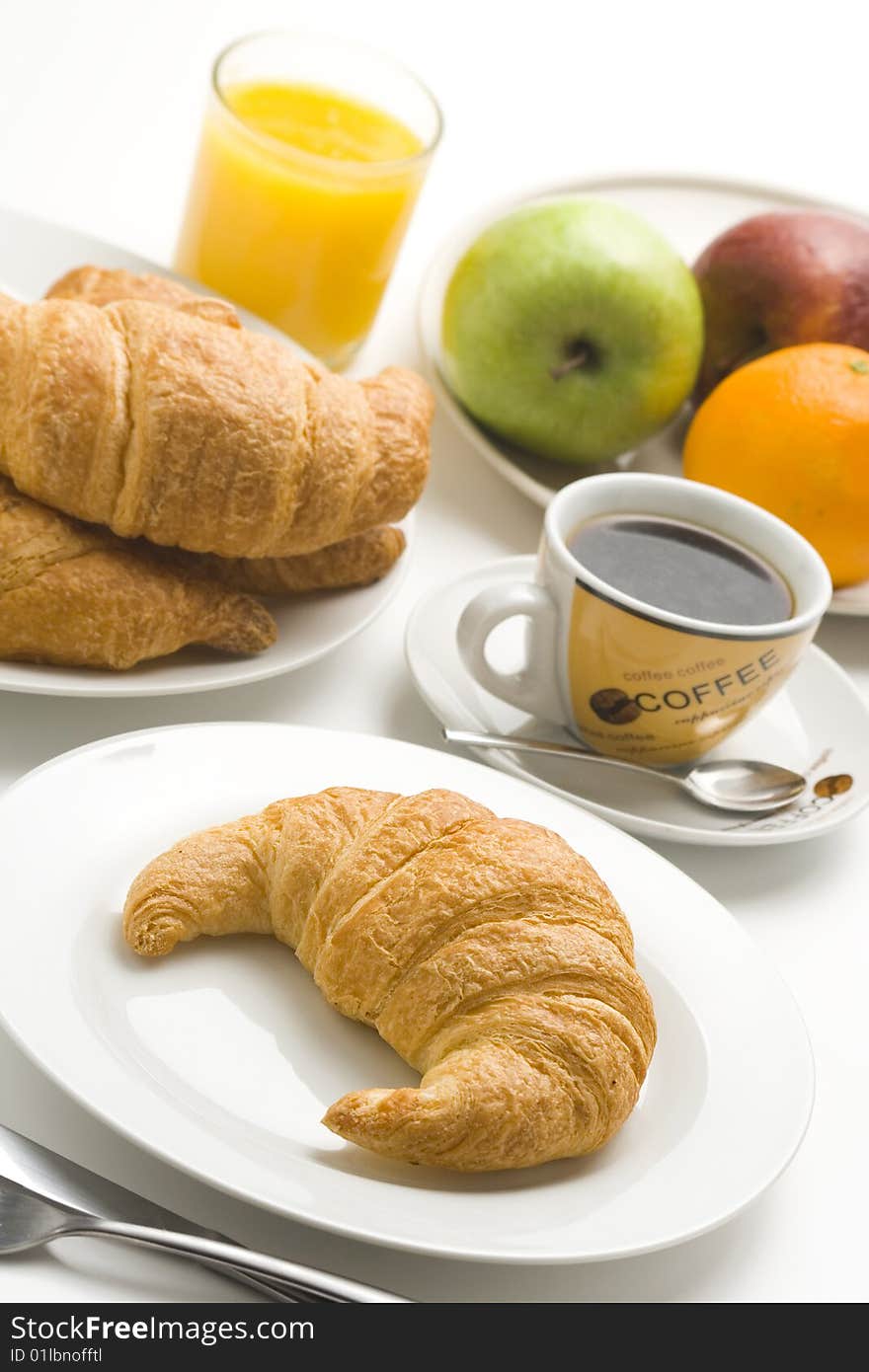 Continental Breakfast Of Coffee And Croissants