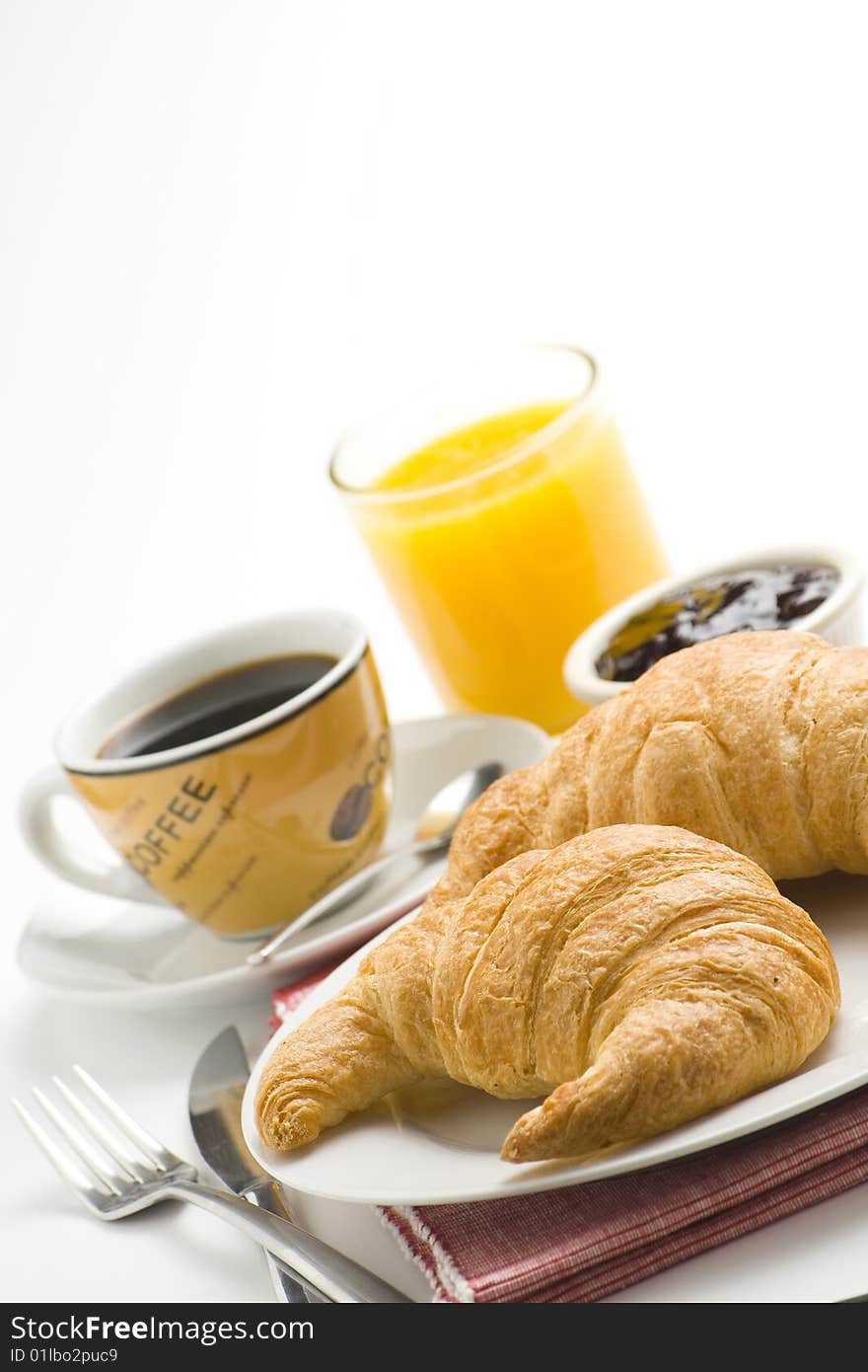 Continental breakfast of coffee and croissants