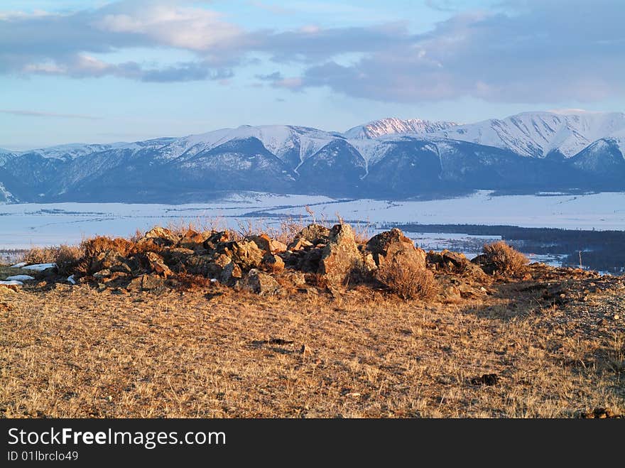 Ancient funeral place in asia mountains  at sunset