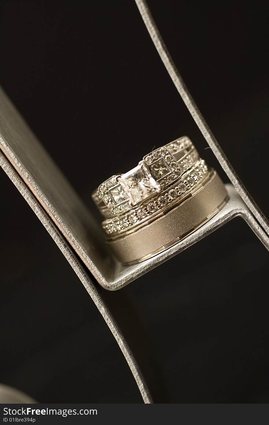 Wedding rings sitting on metal