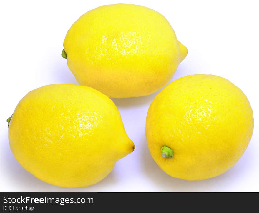 Group of three yellow lemons isolated over white with clipping path