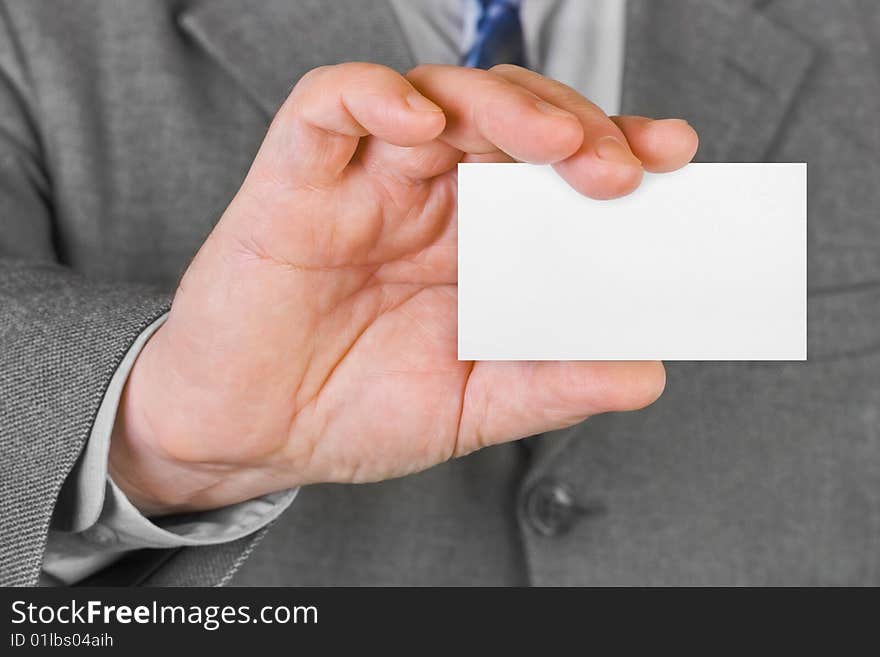 Paper card in hand, business background