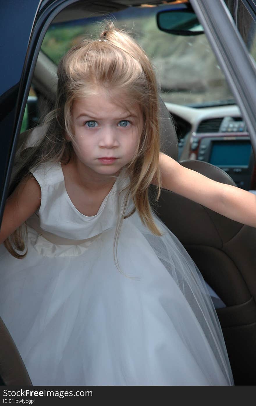 Young girl exiting the car for the wedding. Young girl exiting the car for the wedding