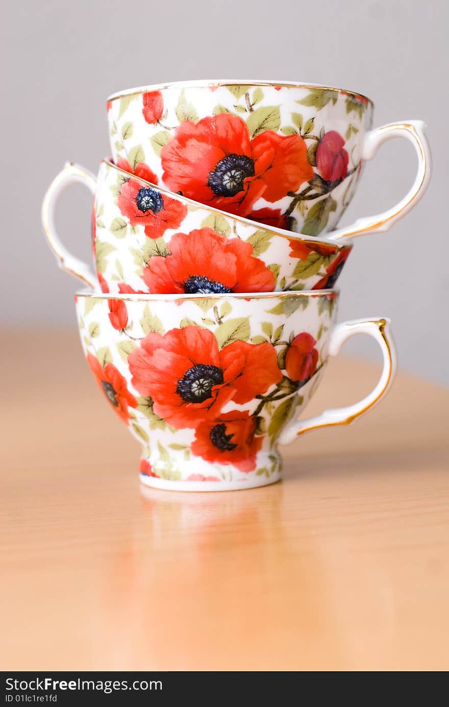 Three cups for coffee with poppies