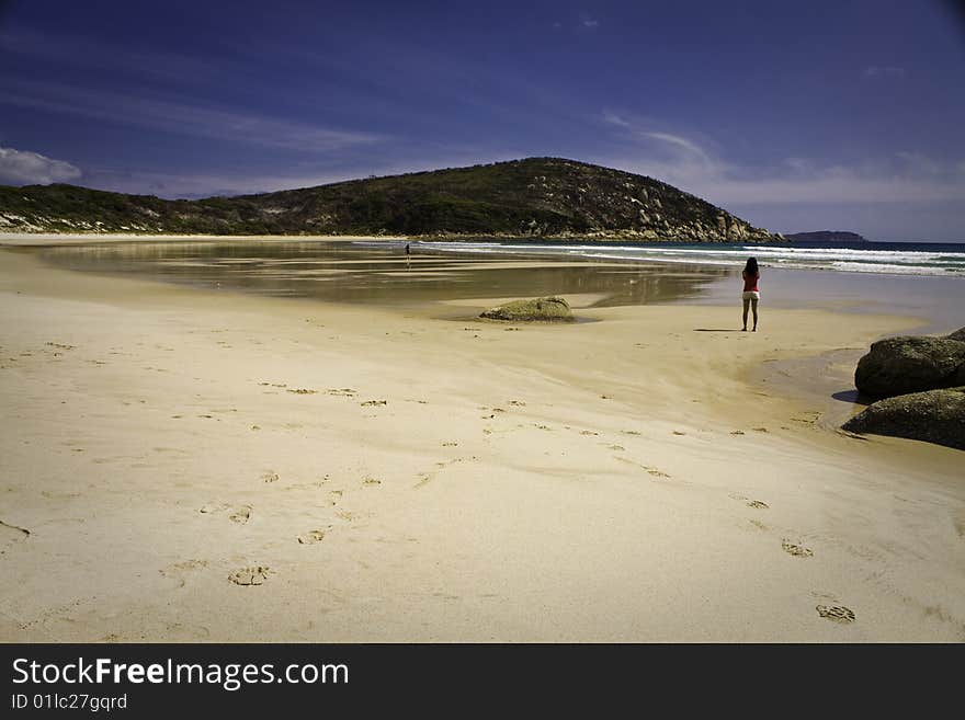 Vast Australian beach with a person in the distance. Vast Australian beach with a person in the distance