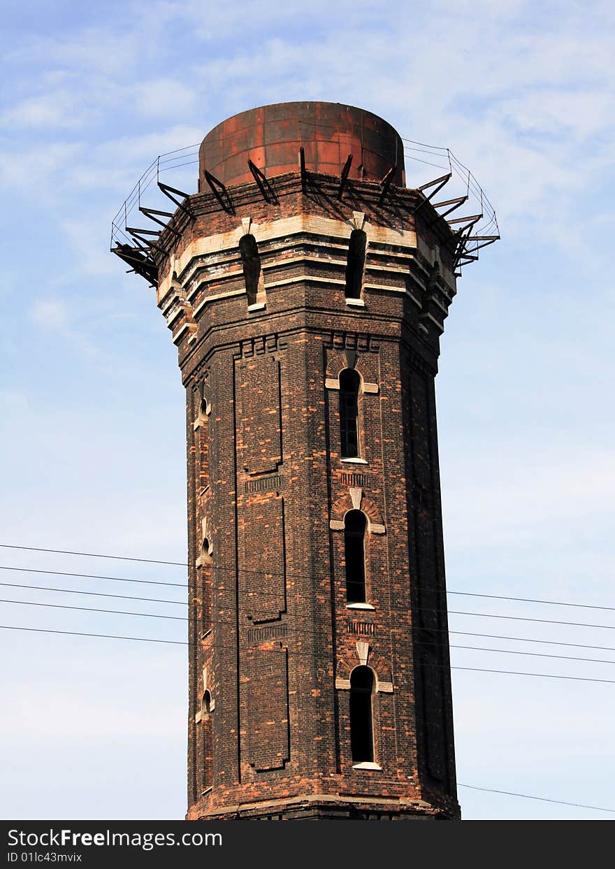 Old red brick water tower built in 19th century