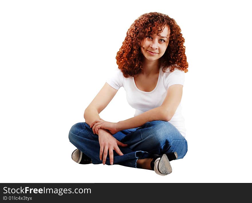 Girl in blue jeans and white T-shirt on a white background