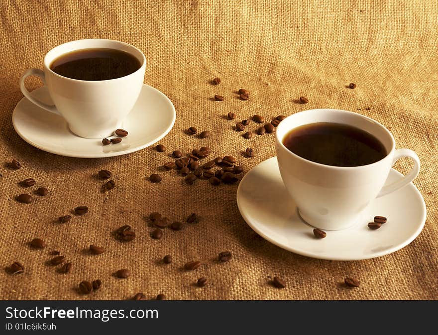 Two cups of coffee to a textile