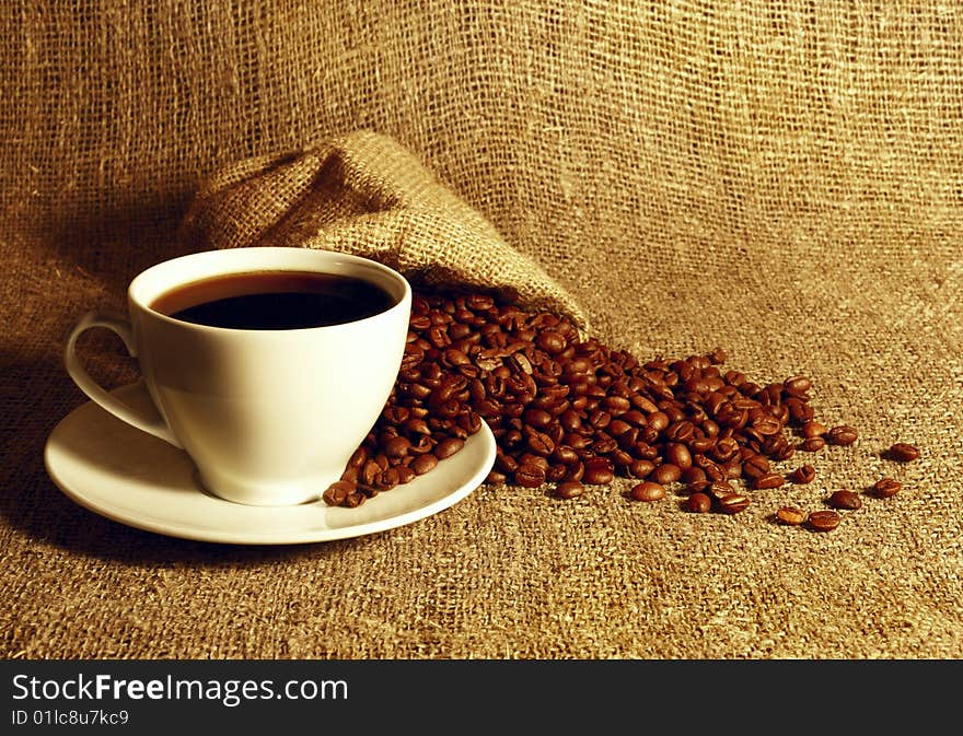 Cup of coffee at the textile background. Cup of coffee at the textile background