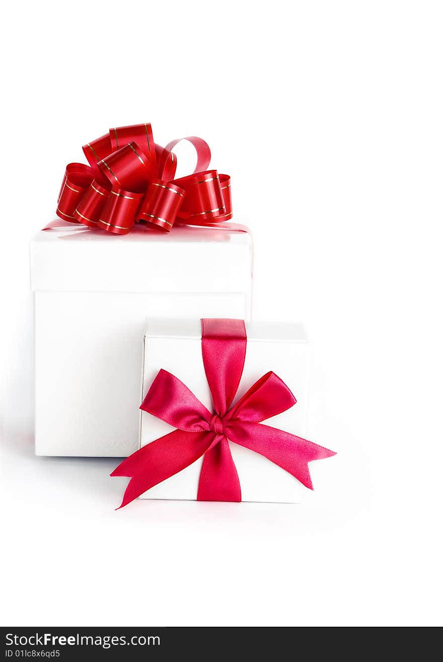 Box with red ribbon on white background