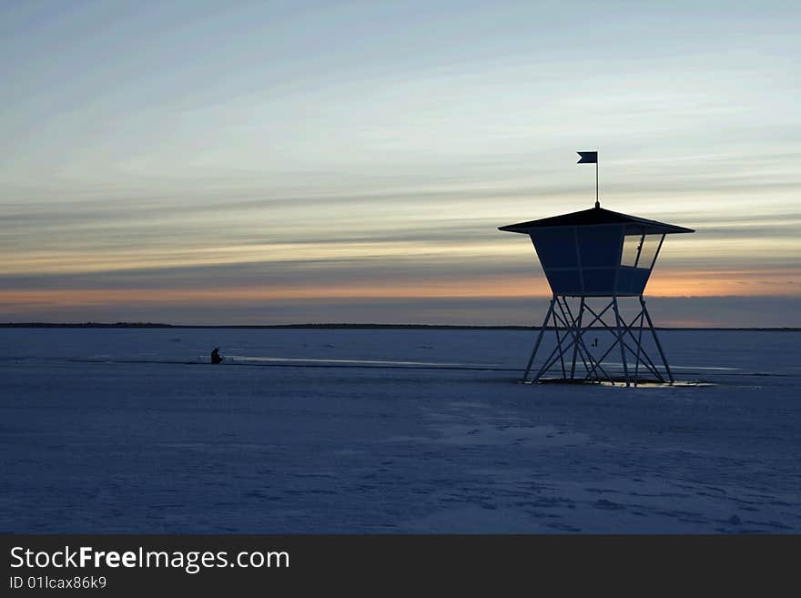 Sunset Over Frozen Lake