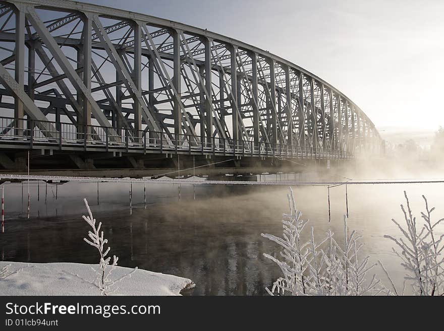 Very cold day, view over a river and bridge