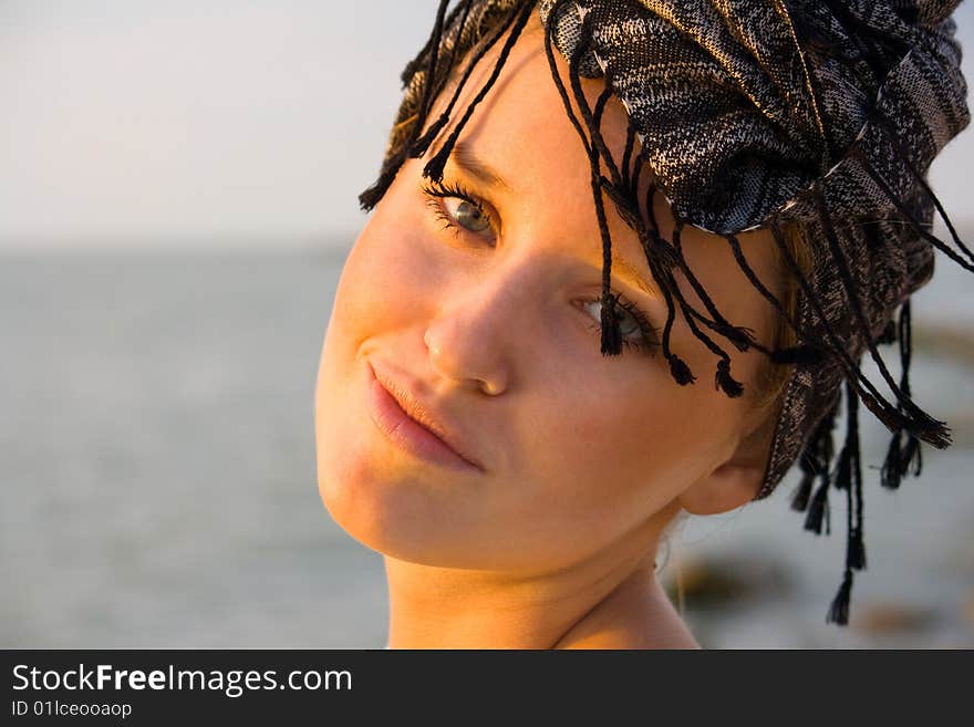 A young girl in the headdress. A young girl in the headdress