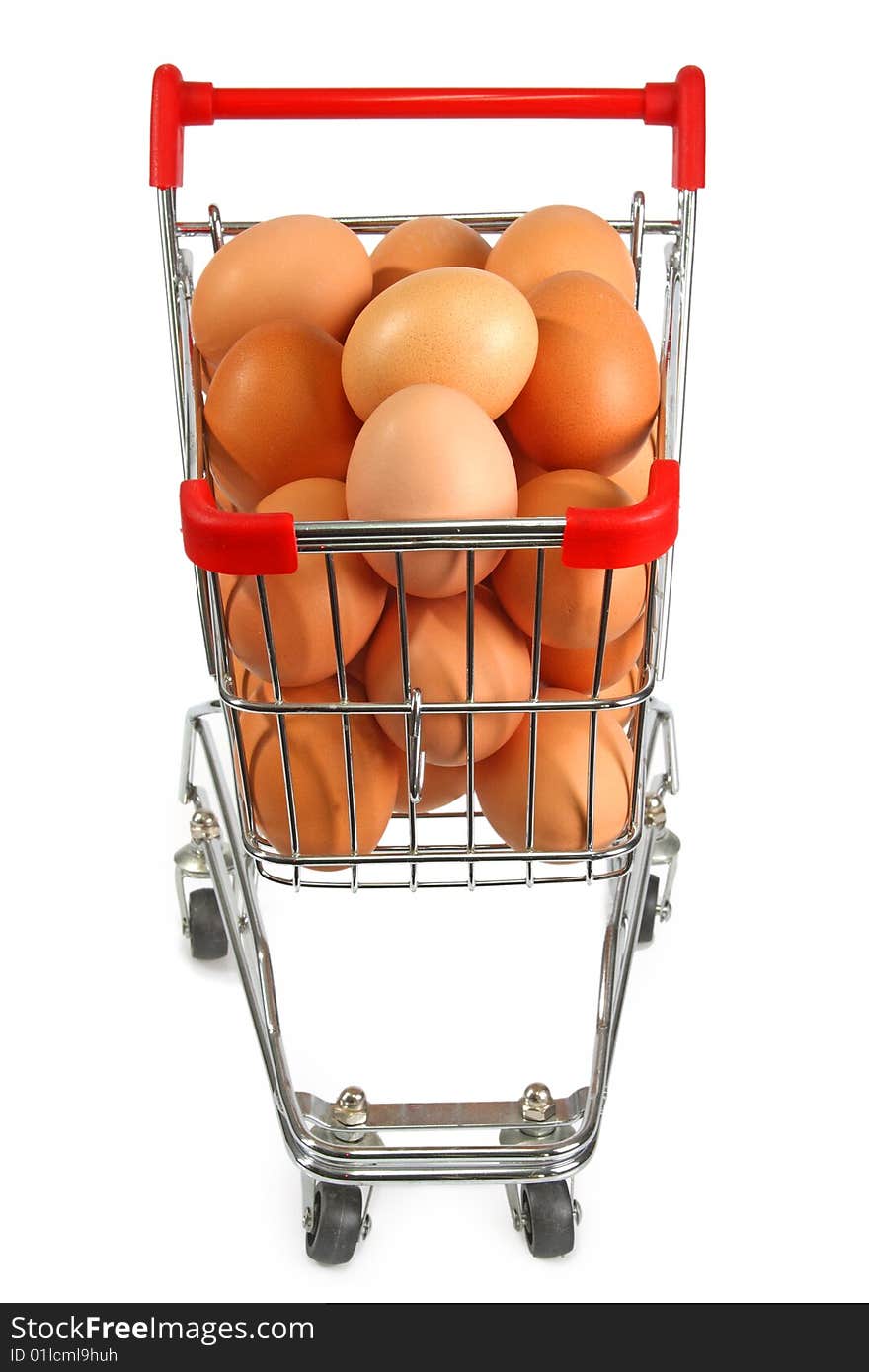 Shopping trolley filled with brown eggs on bright background