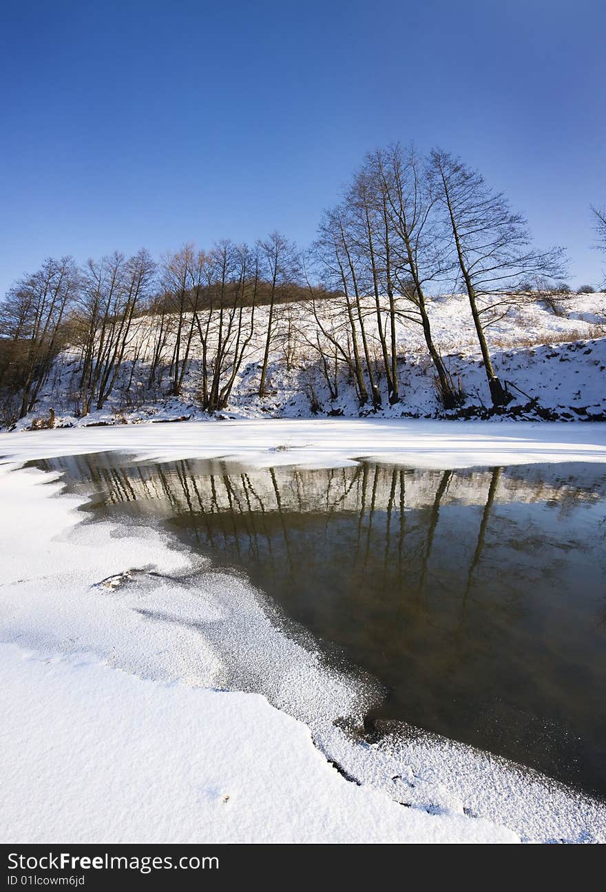 Winter lanscape with frozen river