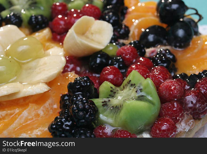 Delicious cake with fruits close up