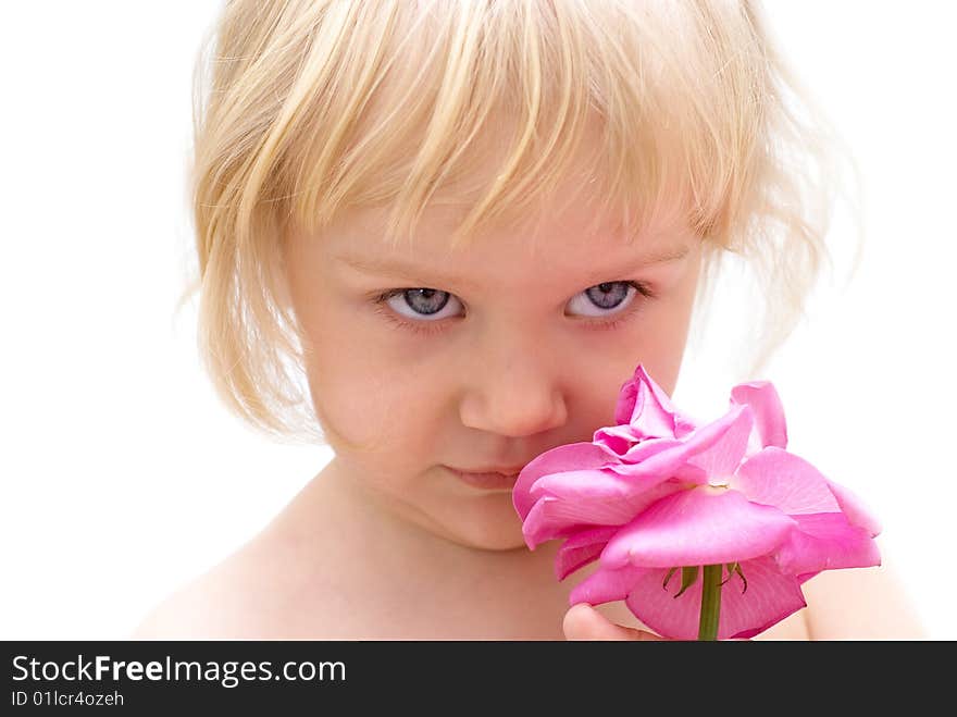 The little blonde girl holding a rose in hand. The little blonde girl holding a rose in hand