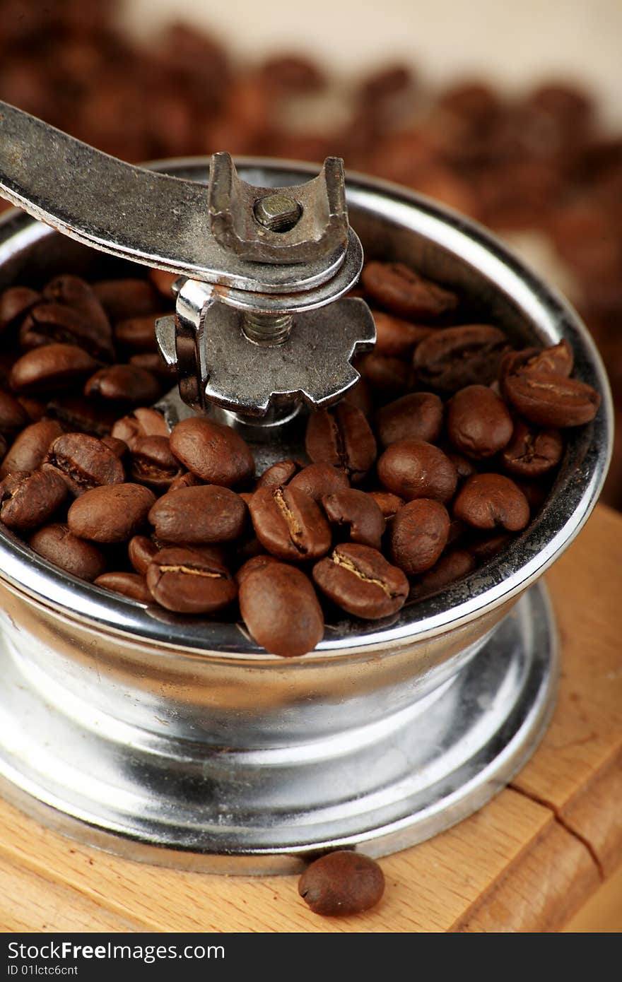 Coffee background: Close-up of a beans cup, mill. Coffee background: Close-up of a beans cup, mill