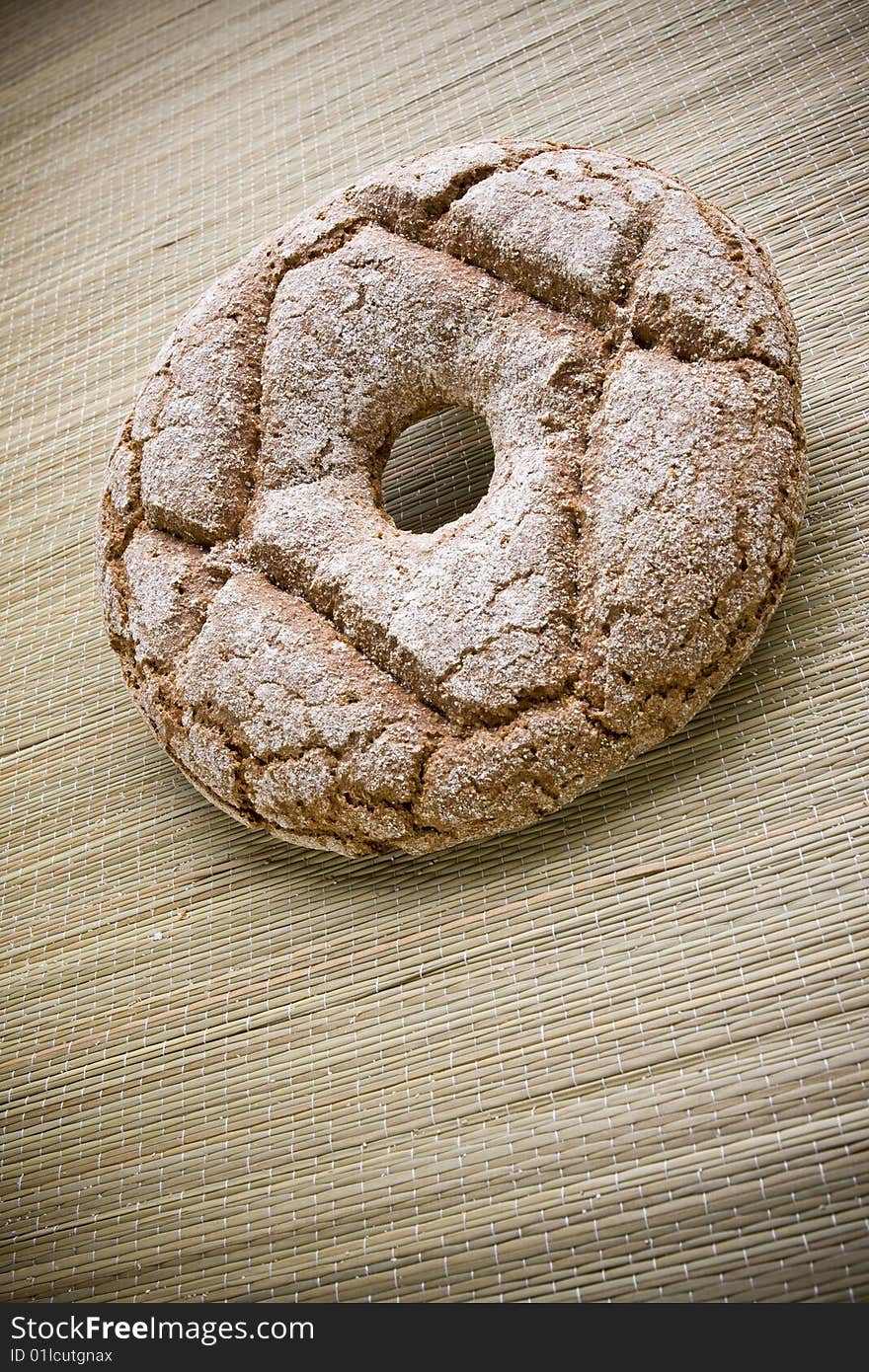 Fresh round rye bread on table