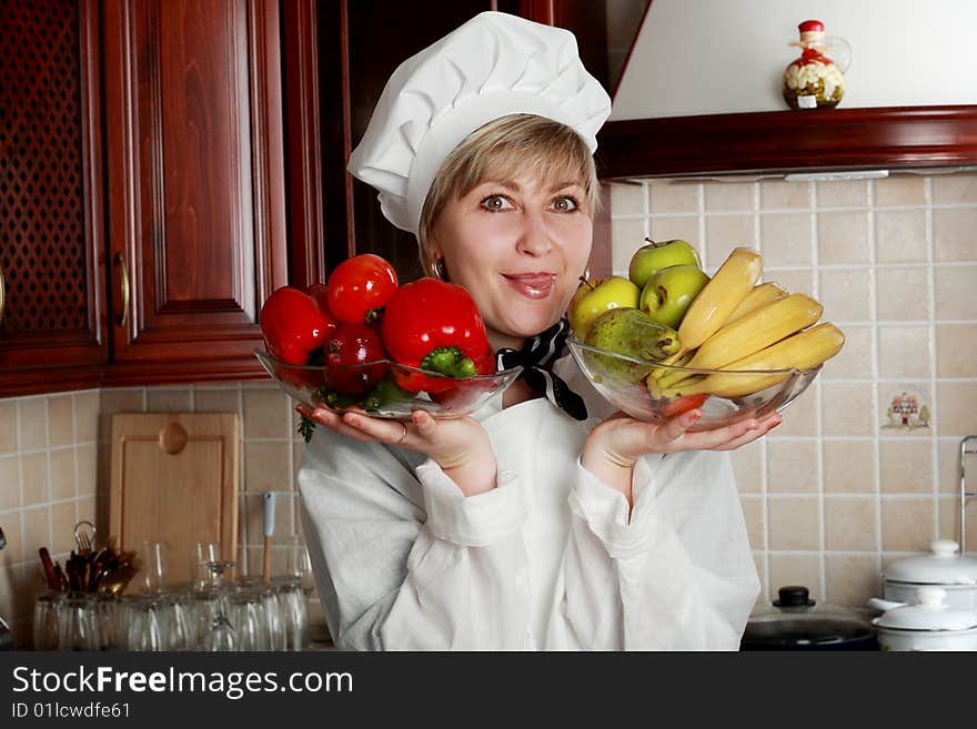 Cook is cooking on the kitchen. Cook is cooking on the kitchen