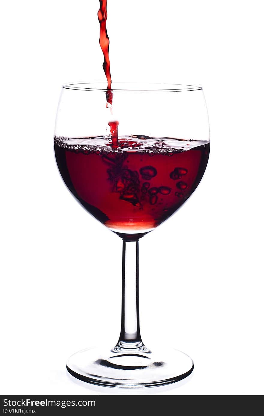 Red wine in glass with white background