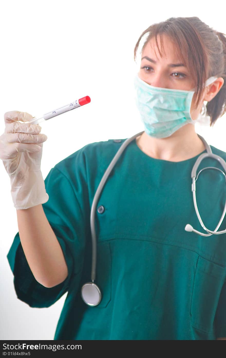 Female doctor checking the bio sample from the medical tube. Female doctor checking the bio sample from the medical tube