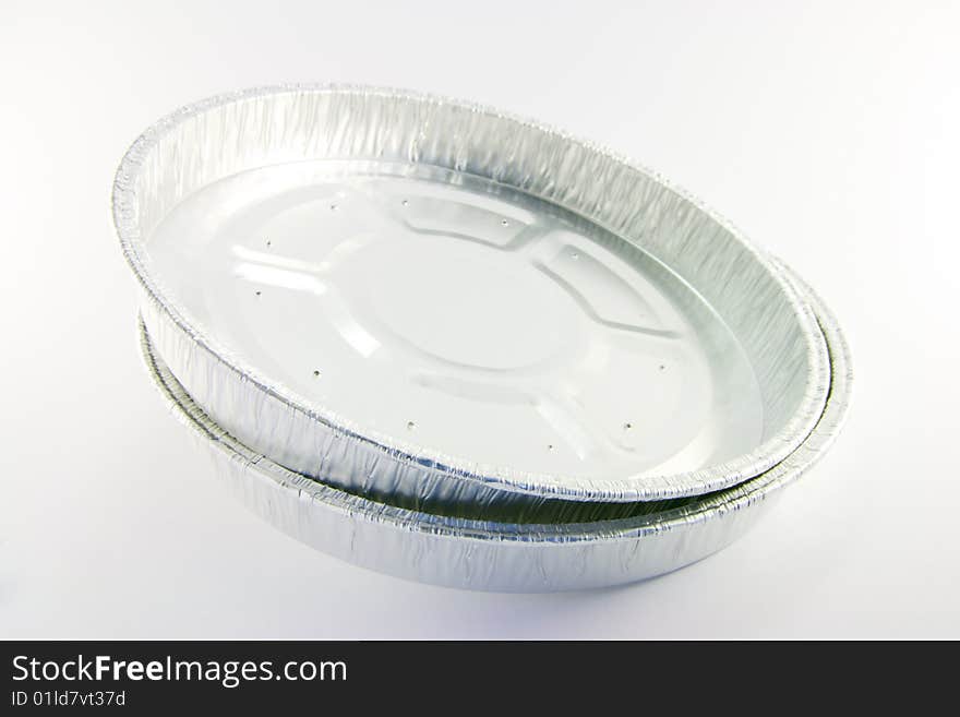 Two round high sided catering trays on a white background. Two round high sided catering trays on a white background