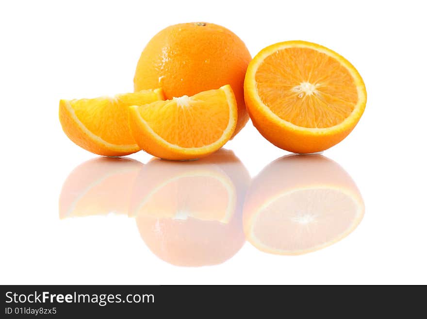 Orange pieces put together with fresh orange isolated on white background. Orange pieces put together with fresh orange isolated on white background.