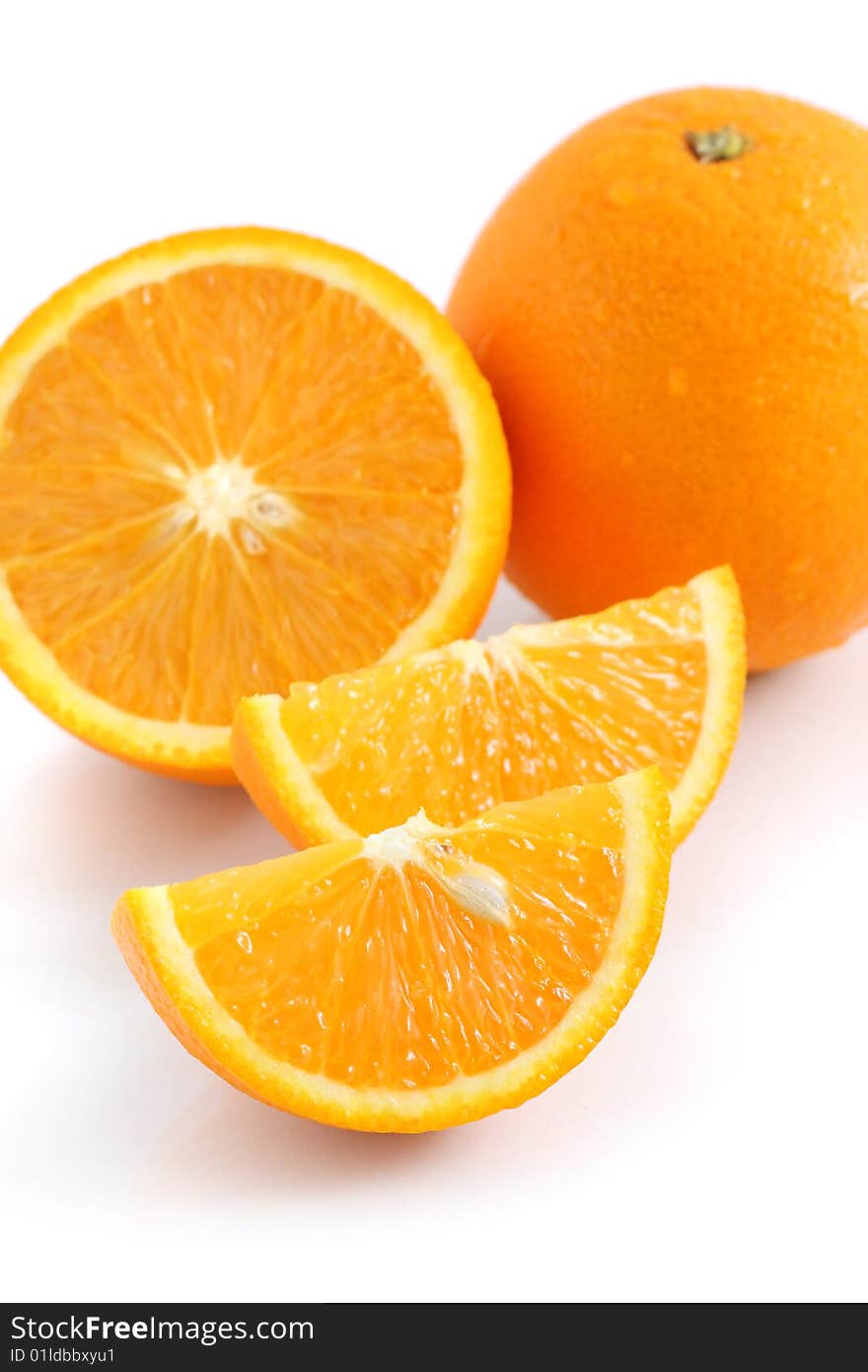 Orange pieces put together with fresh orange isolated on white background. Orange pieces put together with fresh orange isolated on white background.