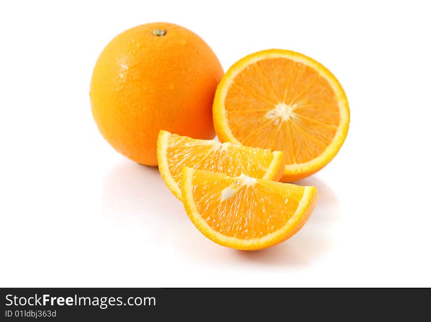 Orange pieces put together with fresh orange isolated on white background. Orange pieces put together with fresh orange isolated on white background.