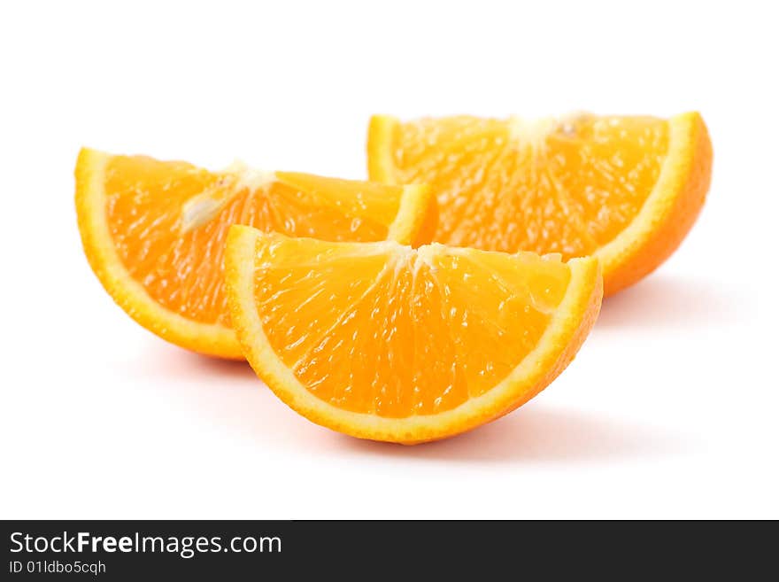 Orange pieces put together and isolated on white background. Orange pieces put together and isolated on white background.