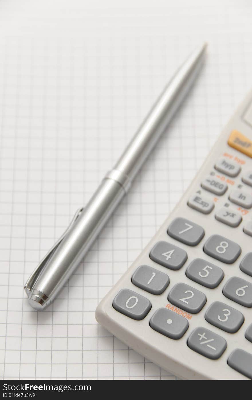 Elegant silver pen and scientific calculator on white blank page