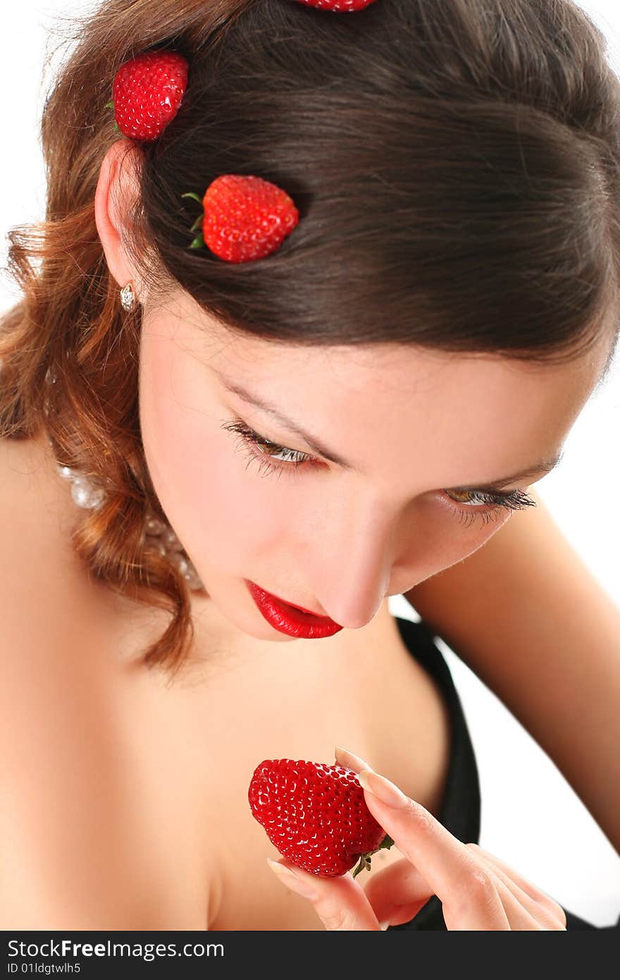 Woman eating strawberry