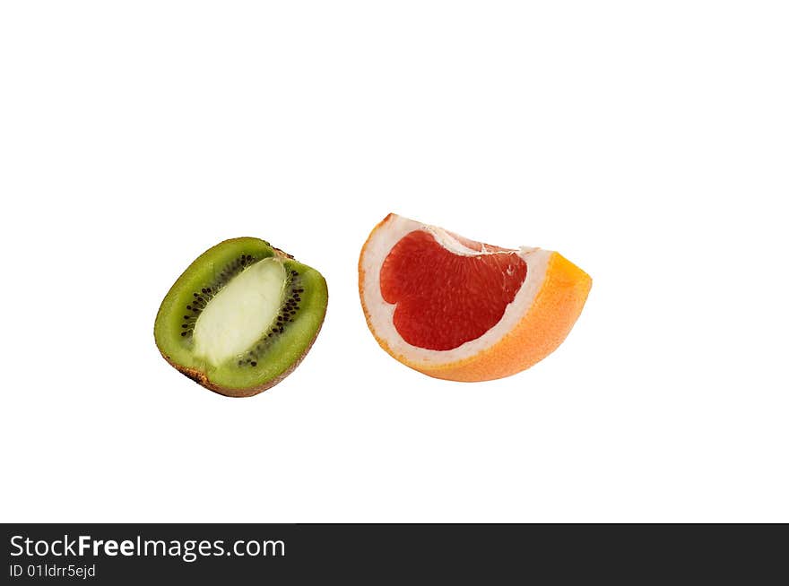 Pieces Of Juicy Kiwi And Grapefruit On A White.