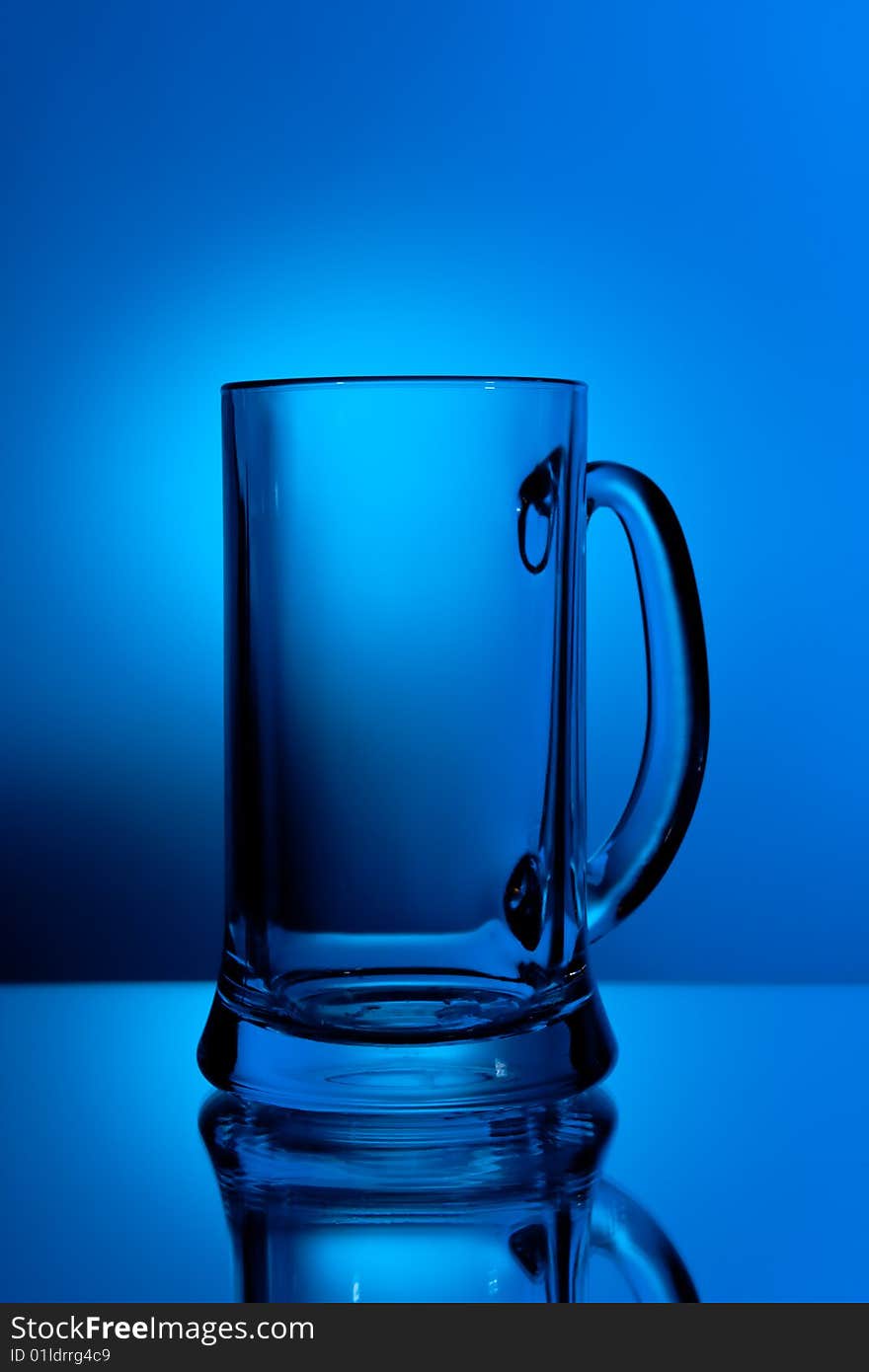 Beer glass in blue light