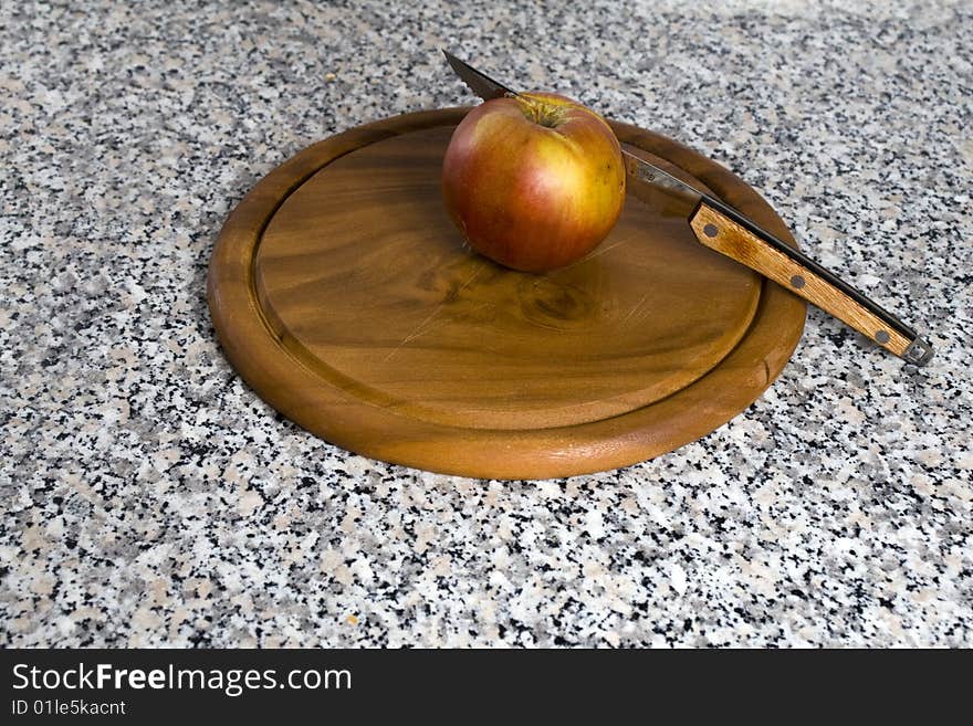 Apple on a cutting board. Apple on a cutting board