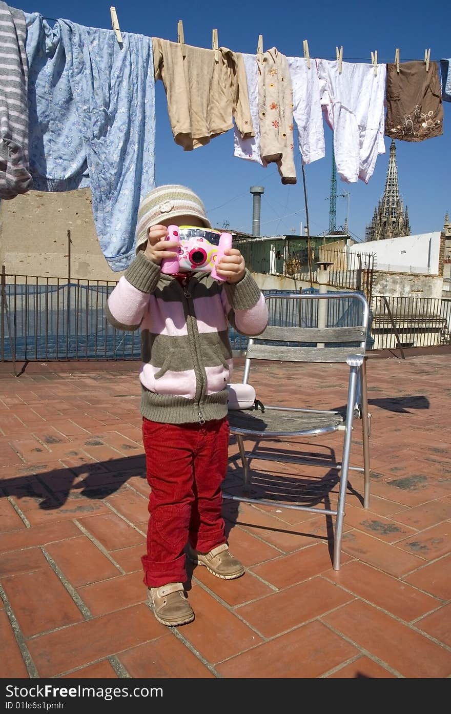 Sweet girl with pink digital camera