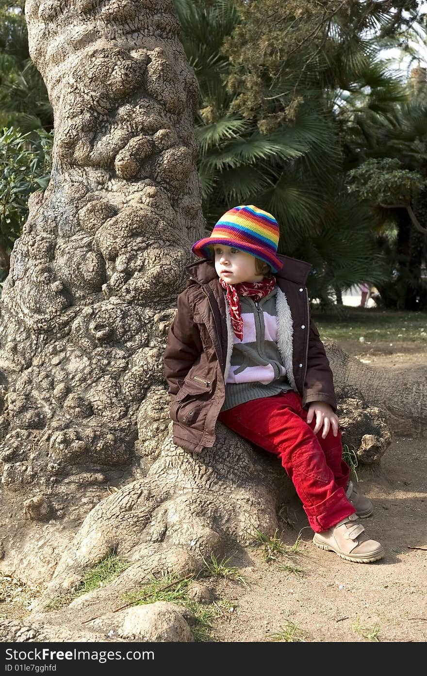 Portait of a sweet girl sitting in the park