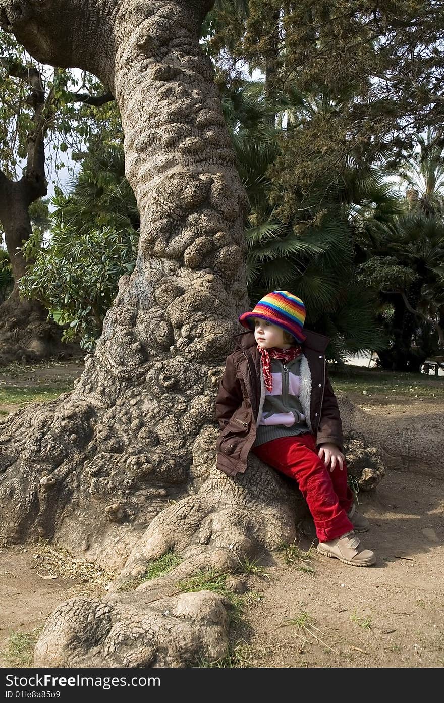 Portait of a sweet girl sitting in the park