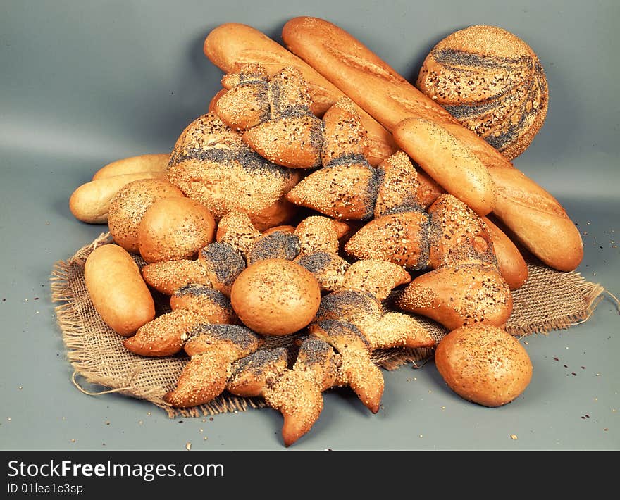 Diferent loaves of bread on light background